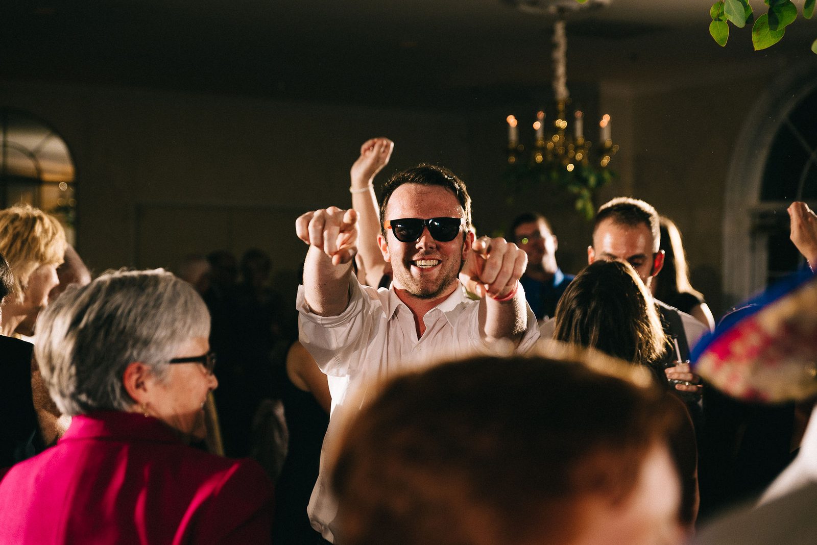 Guests dancing at a wedding reception lit by Independence Events sound and lighting