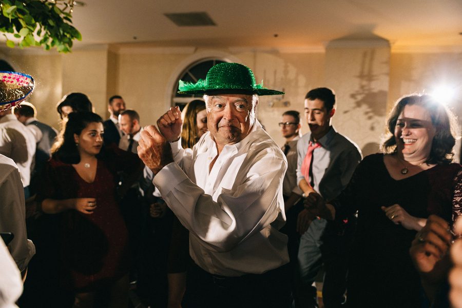 Full dancefloor of guests celebrating at a wedding reception